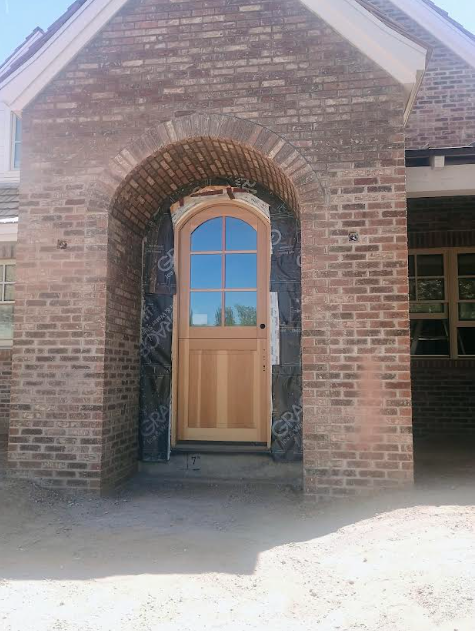 Before photo showing brick arch entryway construction in progress at Daniels Residence in Phoenix AZ
