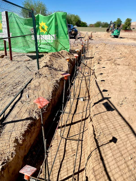 Rebar foundation trench installation at Sunbelt Rentals commercial construction site El Mirage AZ