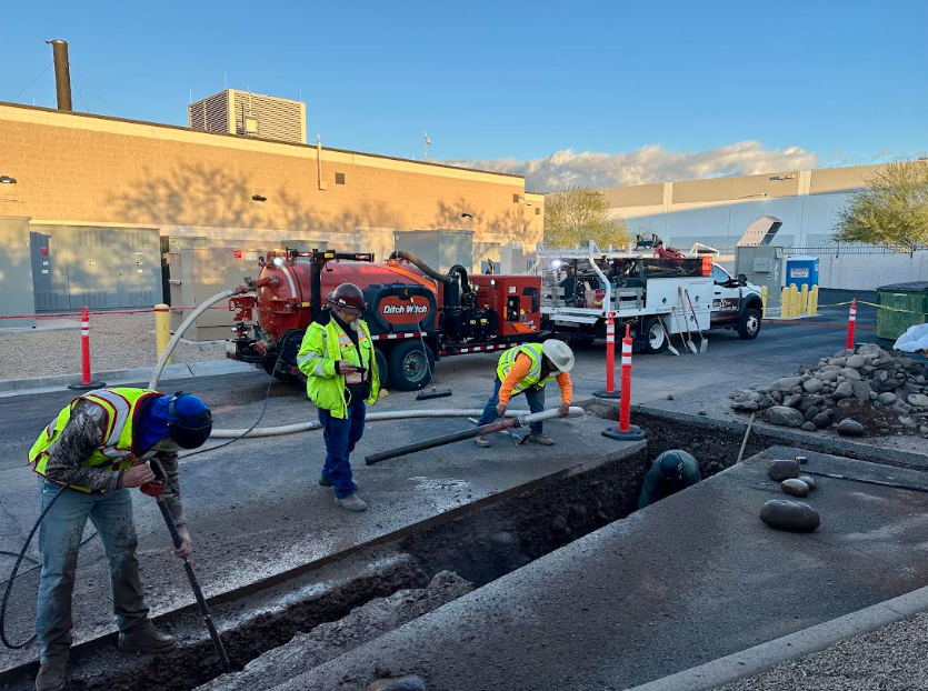 Construction crew using Ditch Witch hydrovac truck for utility excavation at T-Mobile Data Center Phoenix AZ