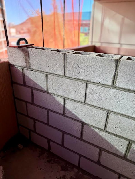 Close up of new CMU block masonry wall construction at JP Morgan Chase parking garage addition Tempe AZ